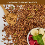 Chocolate and peanut butter granola pieces containing lion's mane extract with peanut butter on a wooden spoon and bowl of raspberries and bananas with label 'Chocolate Peanut Butter'.