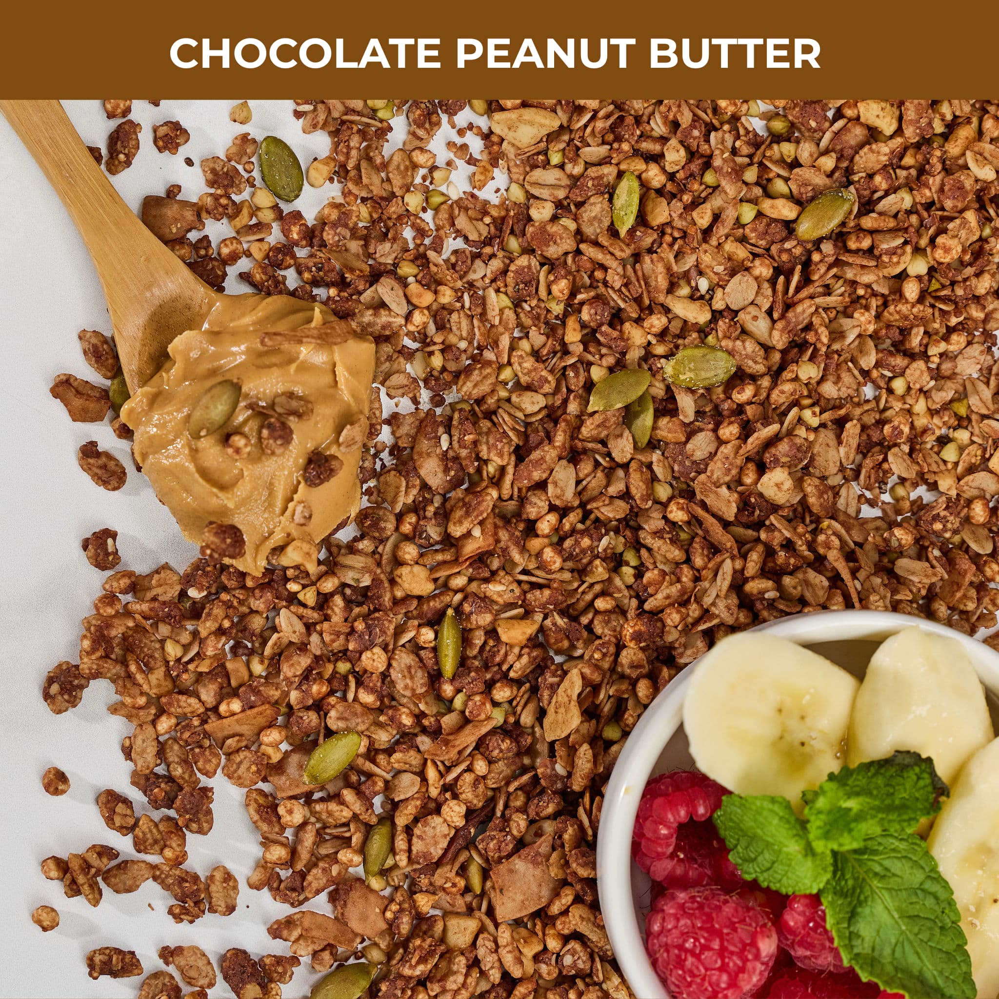 Chocolate and peanut butter granola pieces containing lion's mane extract with peanut butter on a wooden spoon and bowl of raspberries and bananas with label 'Chocolate Peanut Butter'.