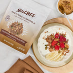 Yogurt bowl with a serving of indulgent but healthy gutBFF Chocolate Peanut Butter superfood granola with fruit.