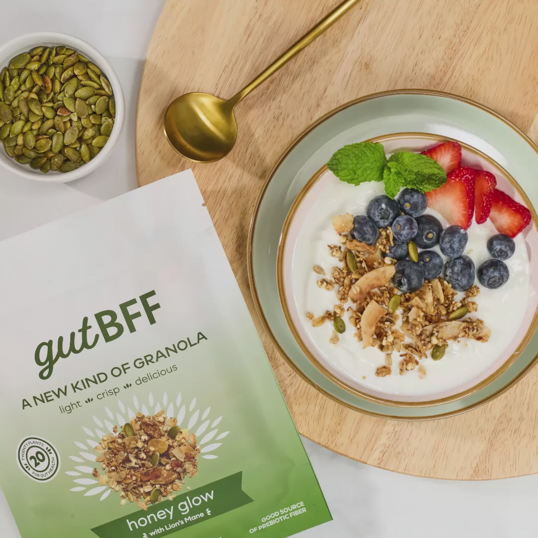 Three rotating images in a video displaying Honey Glow granola in a yogurt bowl, Cinnamon Apple Raisin granola with fruit in a glass bowl, and a variety pack featuring Honey Glow, Cinnamon Apple Raisin, and Chocolate Peanut Butter flavors.